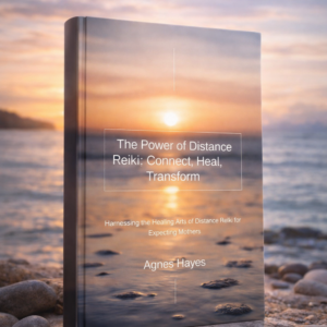 The ebook “The Power of Distance Reiki: Connect, Heal, Transform” by Agnes Hayes, showing a calm sunset over water with stones, symbolizing distance Reiki healing and inner balance.